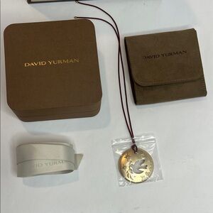 David Yurman Gold Dove ornament, ribbon, ribbon, bag, and jewelry pouch.